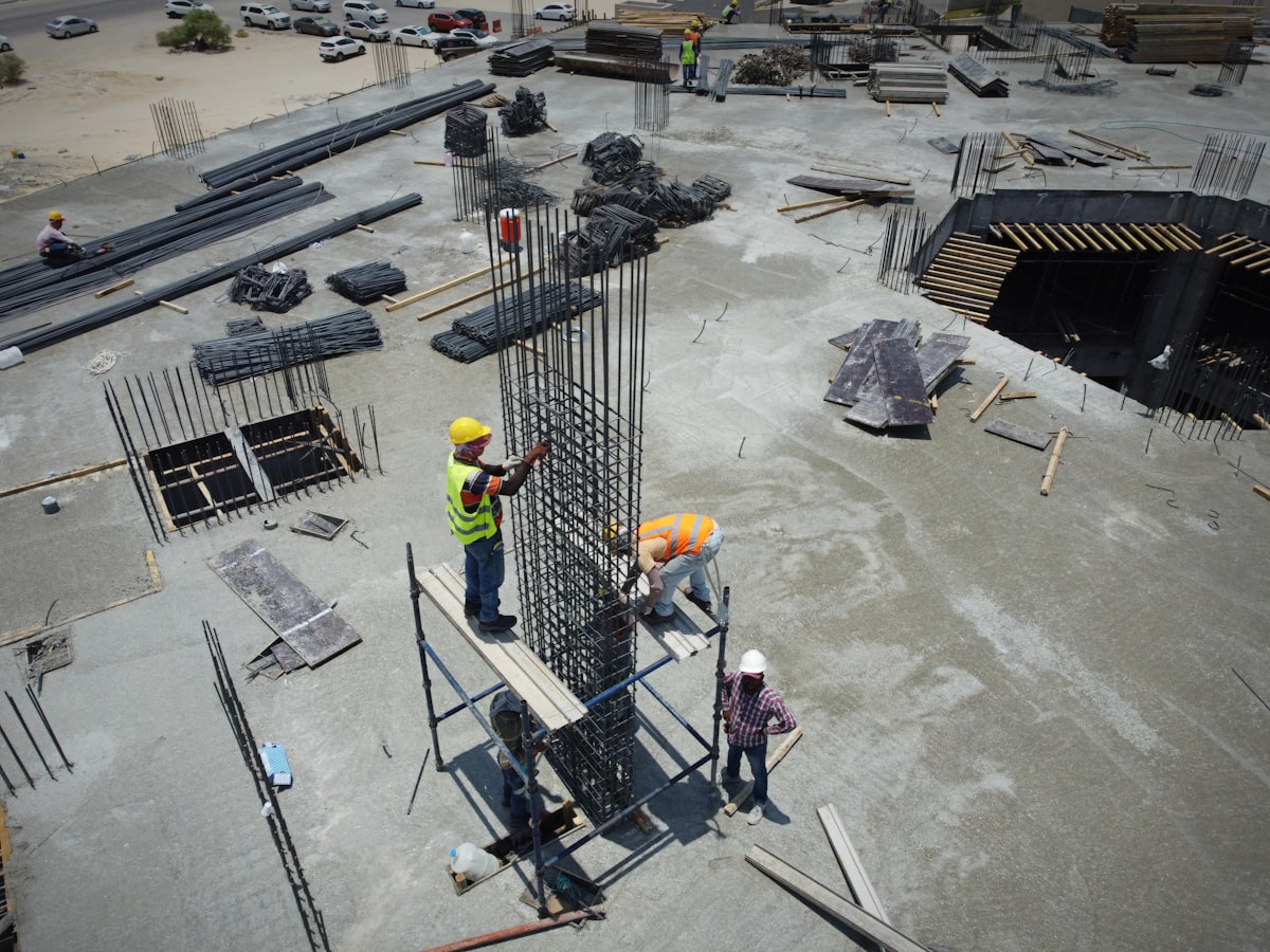 A group of men standing on top of a construction site