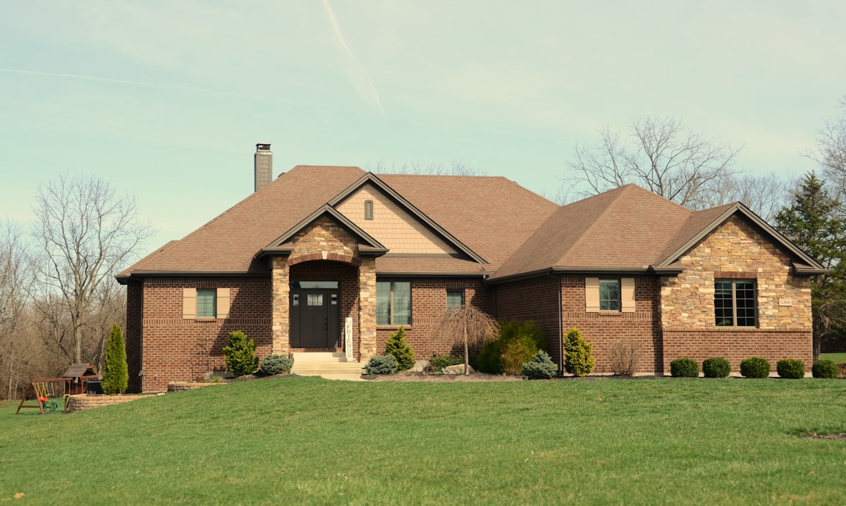 A large brick house with a stone facade.